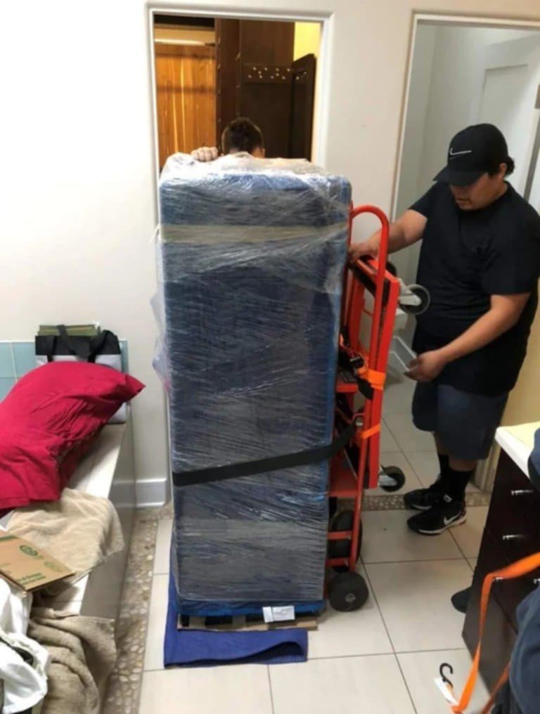 Professional movers carrying furniture in Columbia SC